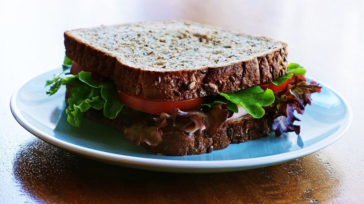 Delicious and nutritious homemade sandwich with whole wheat bread and fresh vegetables.